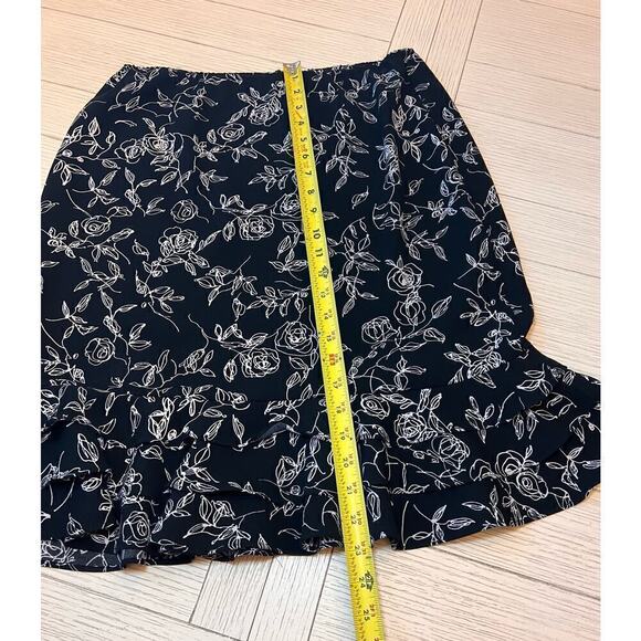 Floral print zip closure w/ elastic waist knee length skirt with ruffle trim. 12 - Picture 6 of 9